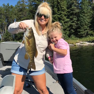 Guest With A Girl Holding A Walleye