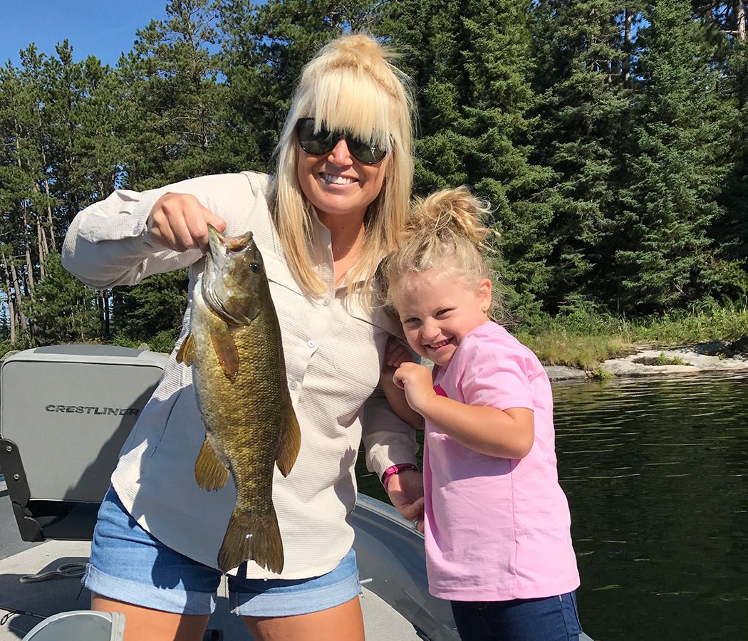 Guest With A Girl Holding A Walleye Aspect Ratio 630 540