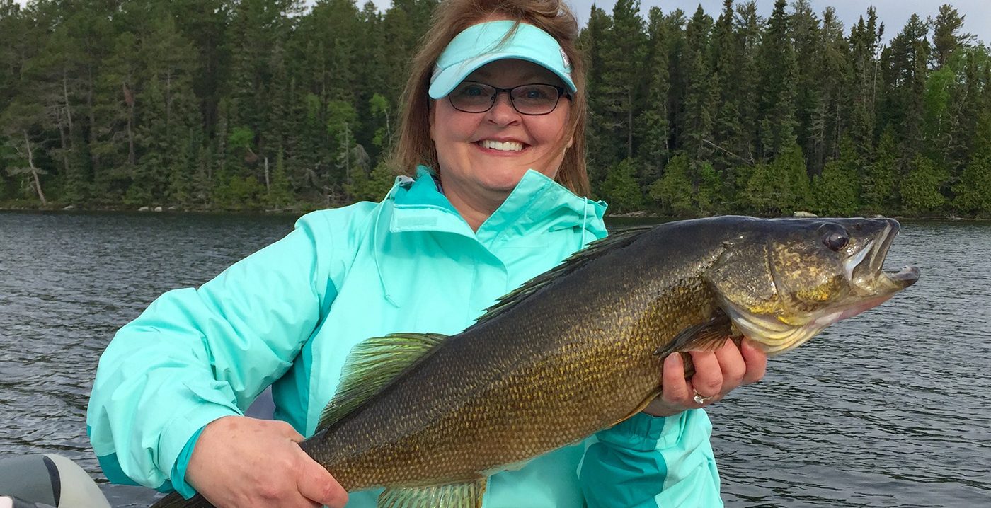 Woman Holding A Large Walleye Aspect Ratio 984 505